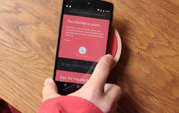 a renter getting a tour from their Airbnb hosts via the Ping device